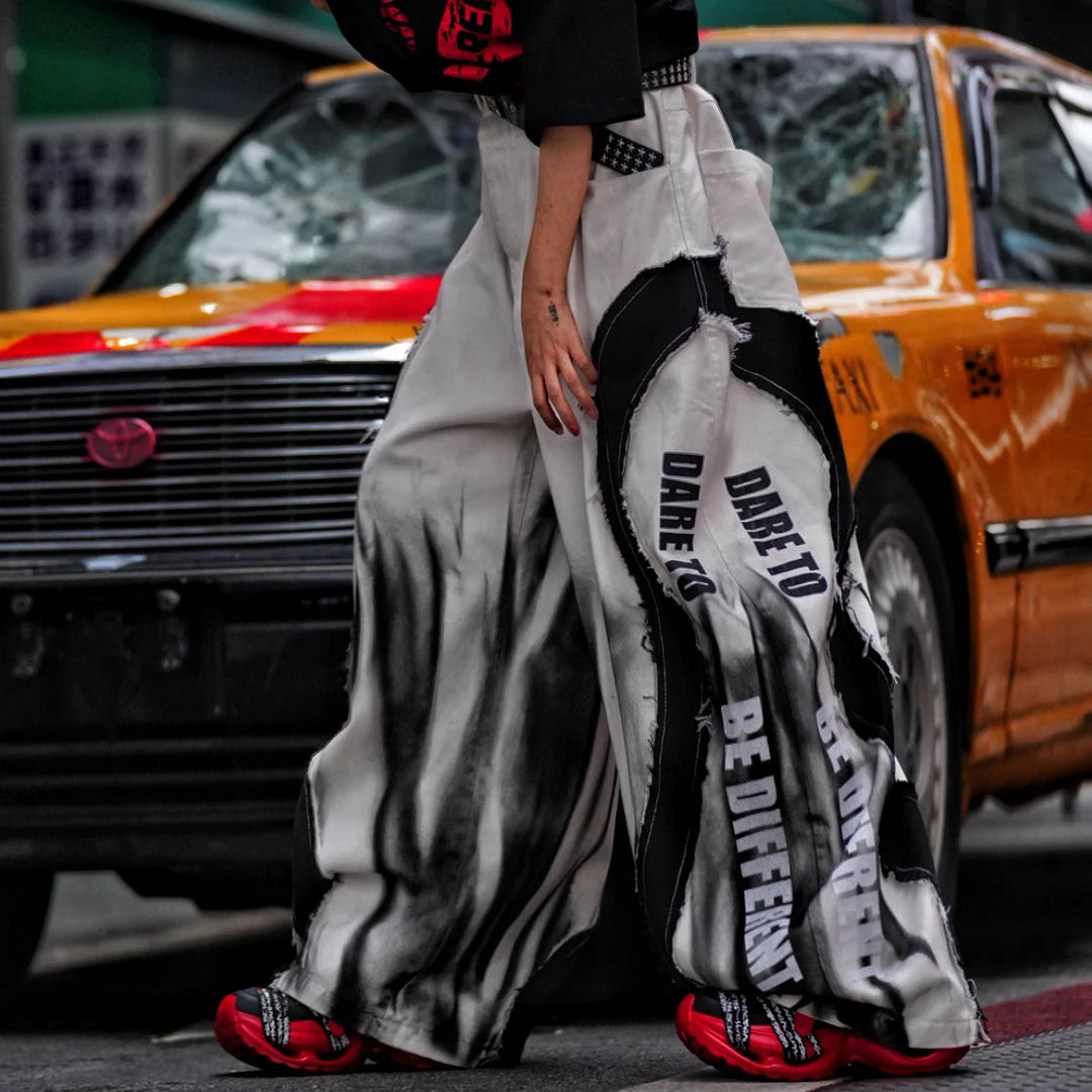 Sanhoostudio denim pants featuring distressed wash effects, wide leg scythe-cut tailoring, and a relaxed fit silhouette. Built for everyday streetwear outfits with comfort, durability, and modern styling.
