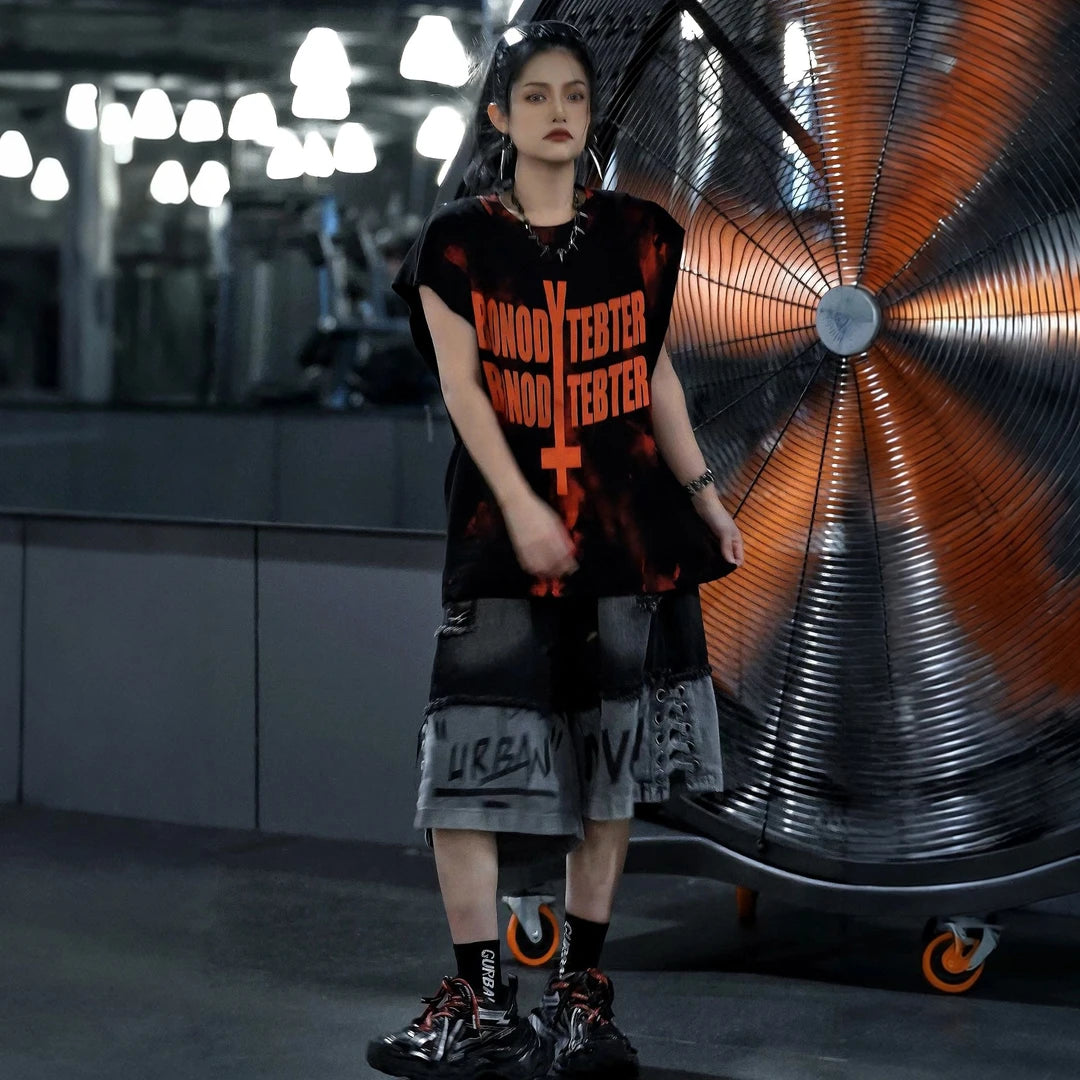 Sanhoostudio sleeveless T-shirt featuring distressed detailing, red spray-print artwork, and a relaxed oversized fit. Designed for summer streetwear styling with breathable comfort and a bold urban aesthetic.