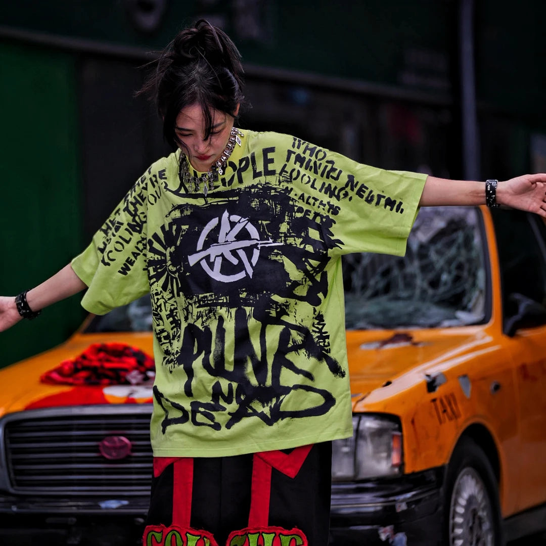 Sanhoostudio short sleeve T-shirt featuring spray-print artwork, breathable fabric construction, and an oversized fit silhouette. Designed for modern streetwear styling with comfort and standout summer appeal.