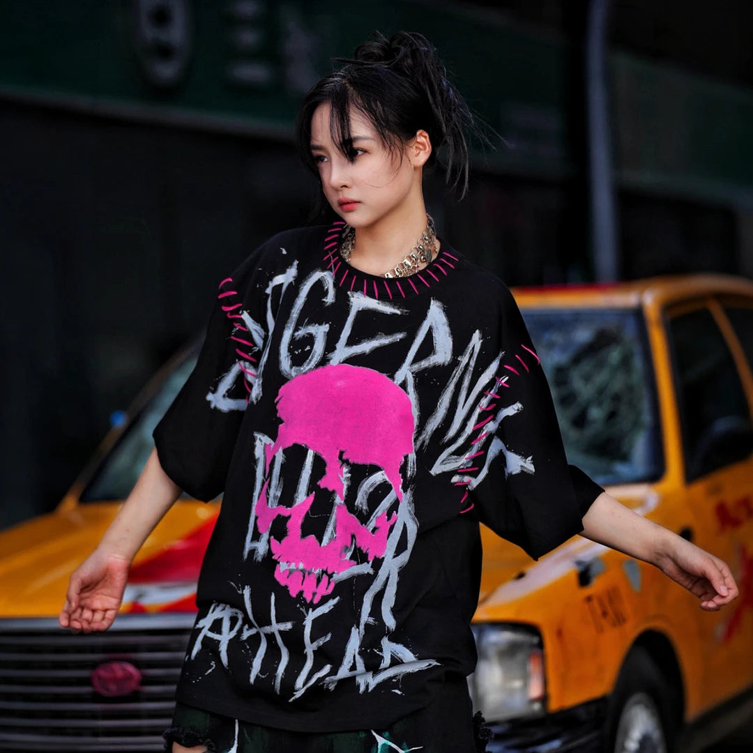 Sanhoostudio short sleeve T-shirt featuring graphic spray-print detailing and a relaxed oversized silhouette. Built for streetwear outfits with breathable comfort, lightweight construction, and versatile everyday styling.