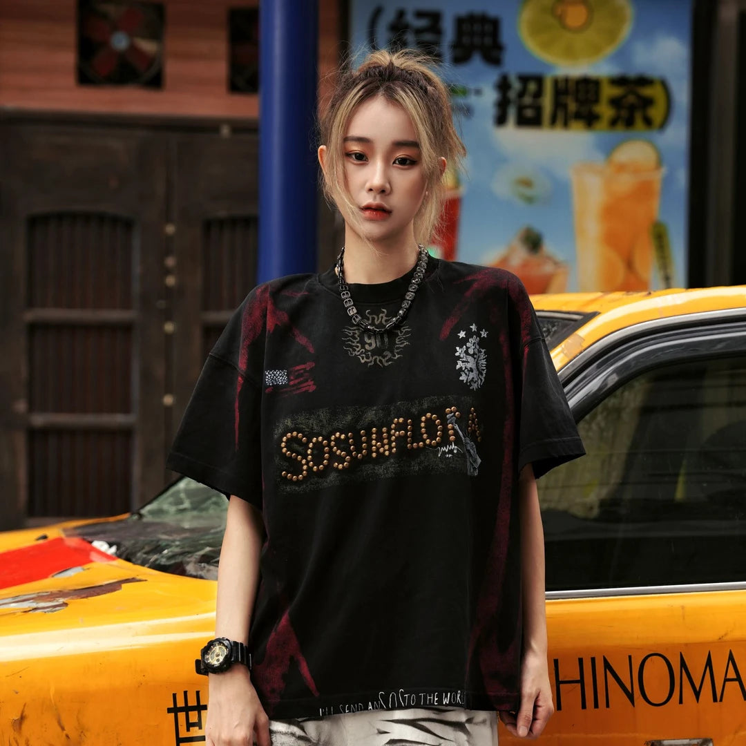 Sanhoostudio jersey-inspired short sleeve T-shirt featuring flame graphics, studded details, and a loose oversized fit. Built for retro streetwear outfits with breathable comfort and standout visual appeal.