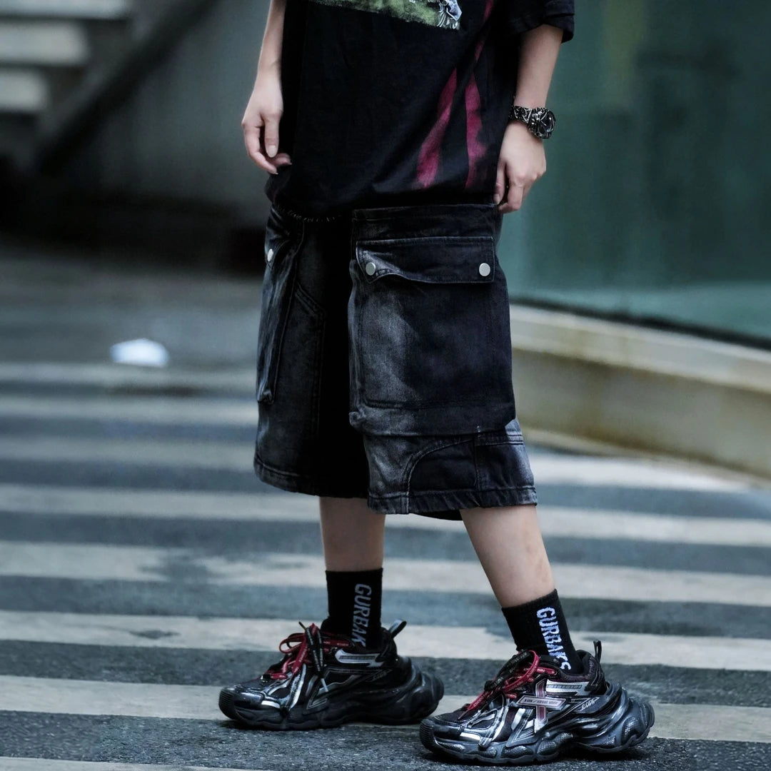 Sanhoostudio cargo shorts featuring washed fabric treatment, oversized pocket detailing, and a relaxed wide leg silhouette. Designed for summer streetwear styling with breathable comfort, lightweight wearability, and a bold urban aesthetic for everyday outfits.