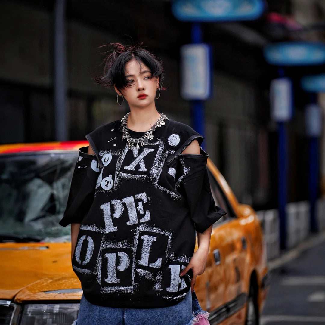 Sanhoostudio short sleeve T-shirt featuring fracture-inspired spray-print artwork, breathable fabric construction, and a relaxed oversized fit. Built for summer streetwear outfits with lightweight comfort and standout graphic styling.