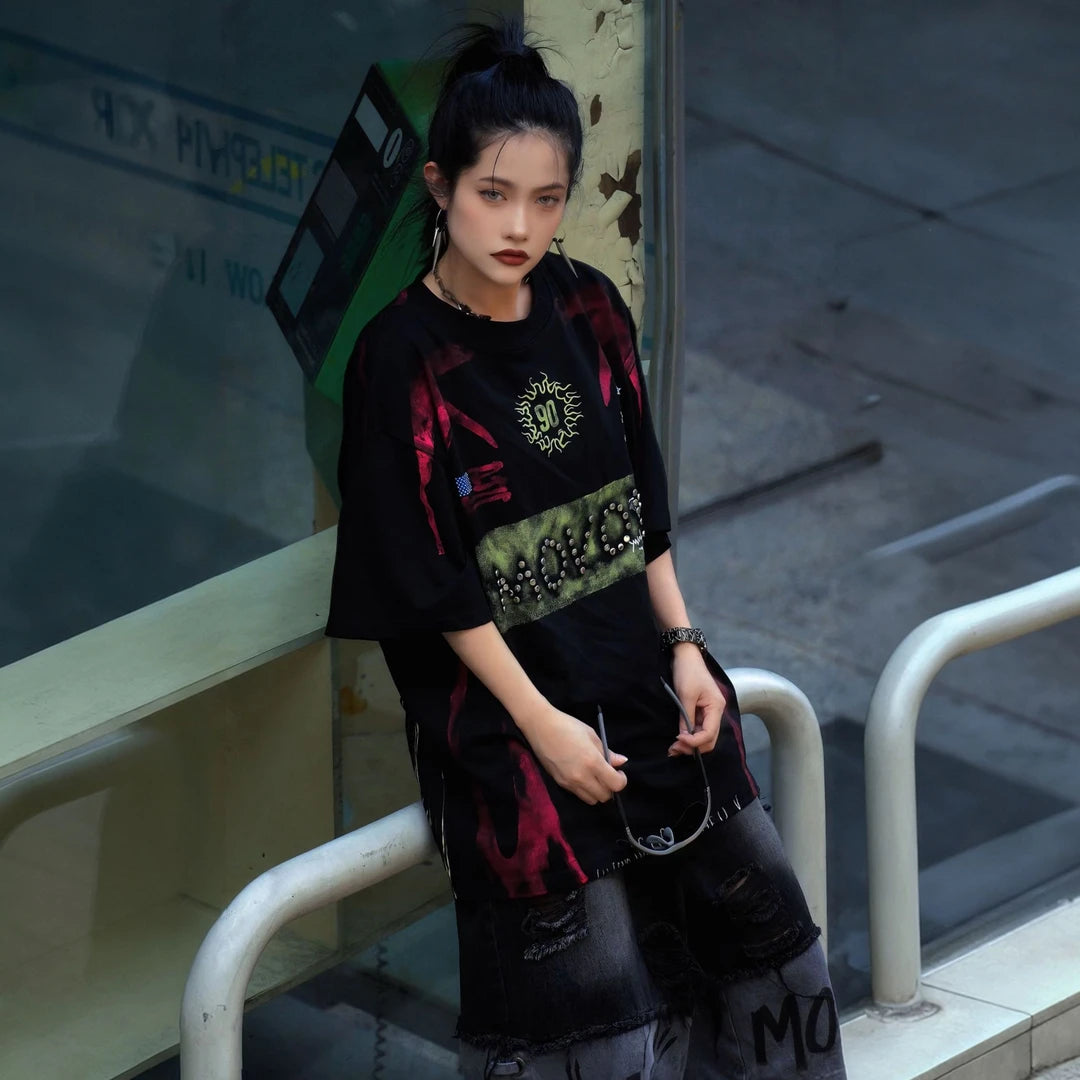 Sanhoostudio short sleeve T-shirt featuring flame-inspired graphics, studded detailing, heavyweight fabric, and a relaxed oversized fit. Designed for vintage streetwear styling with breathable comfort and bold everyday appeal.