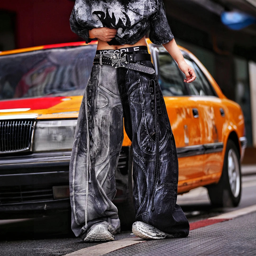 Sanhoostudio denim pants featuring distressed wash treatment, contrast panel construction, and a wide leg scythe-cut silhouette. Designed for futuristic streetwear styling with relaxed comfort and distinctive everyday appeal.
