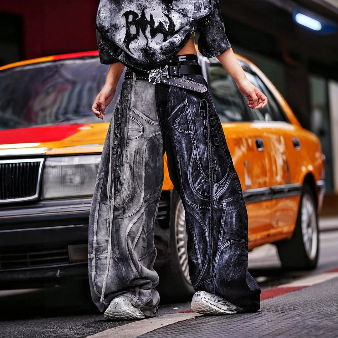 Sanhoostudio denim pants featuring distressed wash treatment, contrast panel construction, and a wide leg scythe-cut silhouette. Designed for futuristic streetwear styling with relaxed comfort and distinctive everyday appeal.