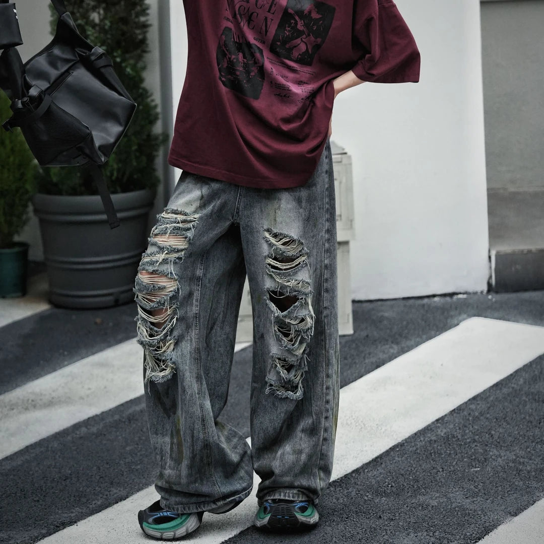 Sanhoostudio straight leg denim pants featuring mud-dye effects, distressed detailing, and a relaxed fit silhouette. Designed for modern streetwear styling with comfortable wear and unique vintage-inspired character.