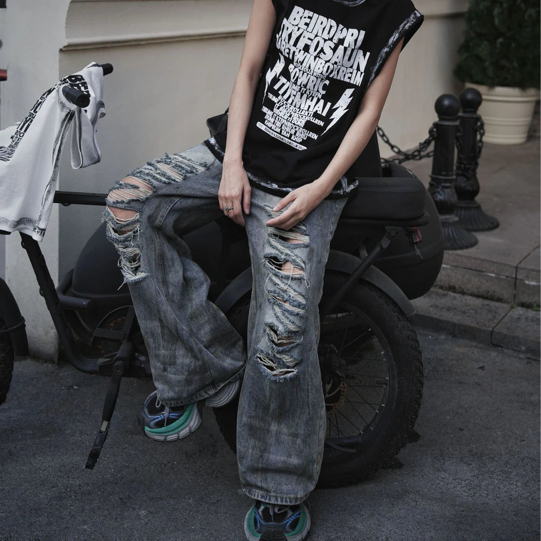 Sanhoostudio straight leg denim pants featuring mud-dye effects, distressed detailing, and a relaxed fit silhouette. Designed for modern streetwear styling with comfortable wear and unique vintage-inspired character.