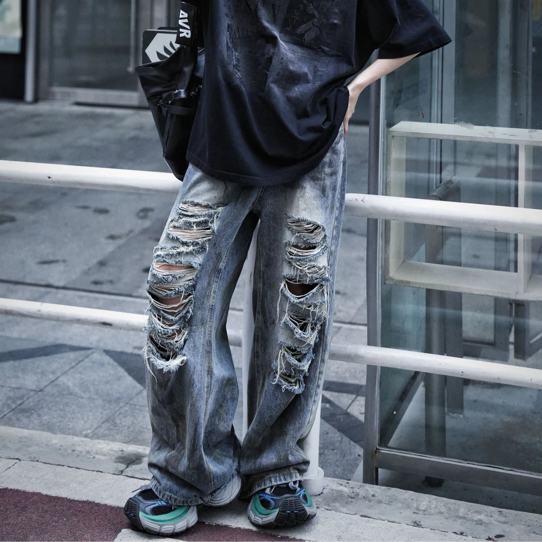 Sanhoostudio straight leg denim pants featuring mud-dye effects, distressed detailing, and a relaxed fit silhouette. Designed for modern streetwear styling with comfortable wear and unique vintage-inspired character.