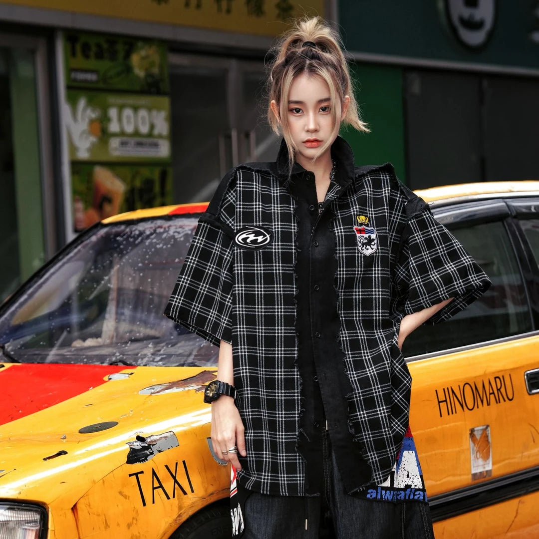 Sanhoostudio short sleeve shirt featuring plaid patchwork construction, distressed vintage details, and a relaxed oversized fit. Designed for versatile summer streetwear outfits with breathable comfort and timeless styling.