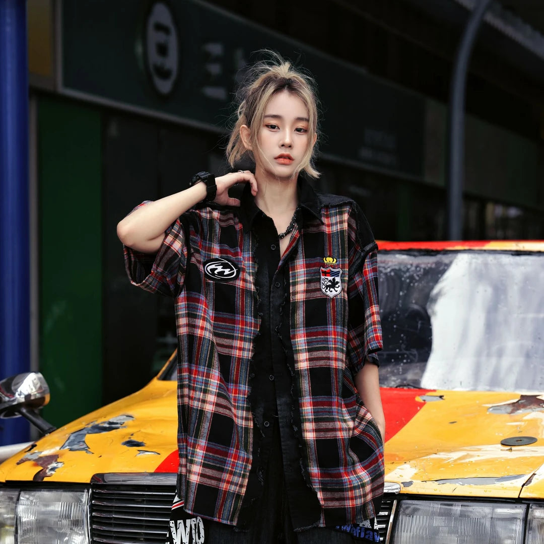 Sanhoostudio short sleeve shirt featuring plaid patchwork construction, distressed vintage details, and a relaxed oversized fit. Designed for versatile summer streetwear outfits with breathable comfort and timeless styling.