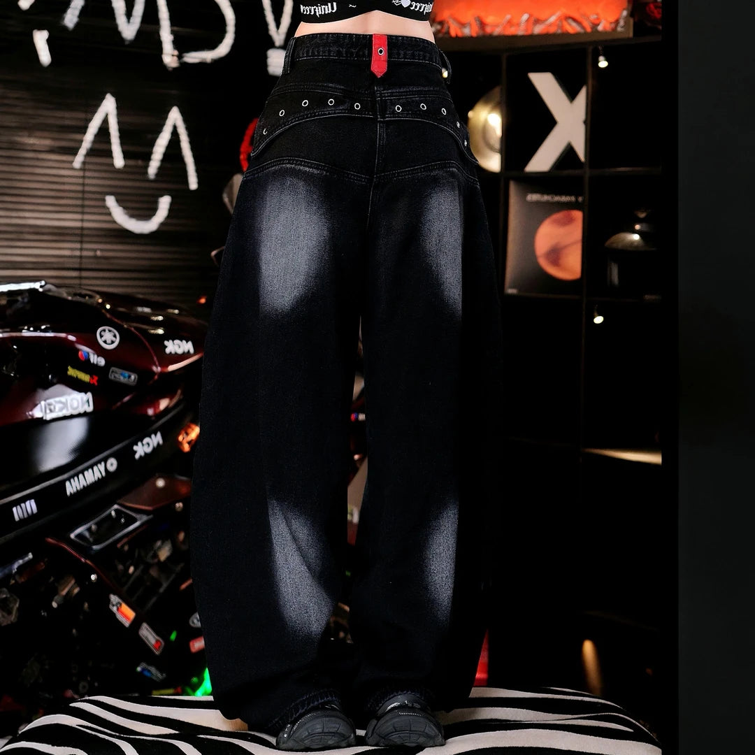 Sanhoostudio denim pants featuring a distinctive double-waist construction, patchwork detailing, and a relaxed wide leg scythe silhouette. Designed with a vintage-inspired streetwear aesthetic for bold everyday styling, comfortable movement, and effortless high-street outfits.