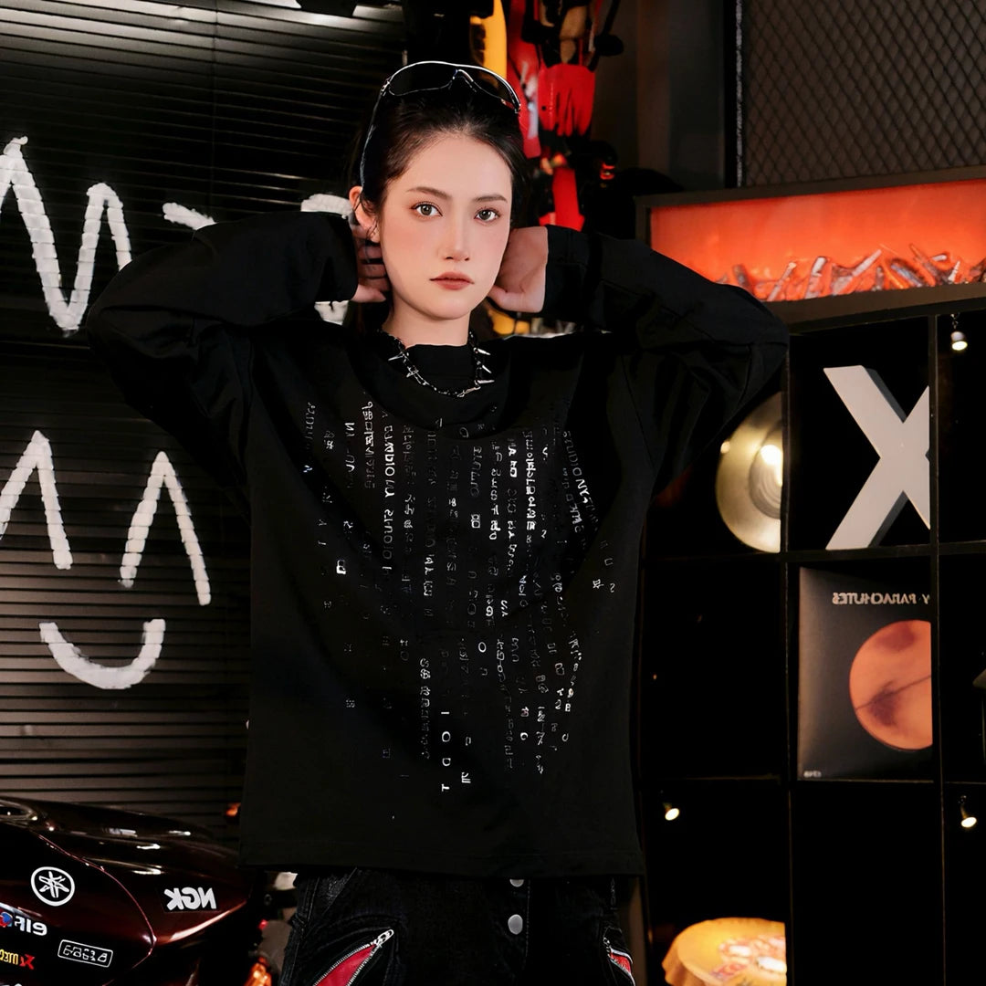 Sanhoostudio long sleeve T-shirt featuring reflective letter graphics and a relaxed oversized silhouette. Designed for dark streetwear and high-street styling, this statement top delivers comfortable everyday wear with eye-catching reflective details and an effortless layered look.