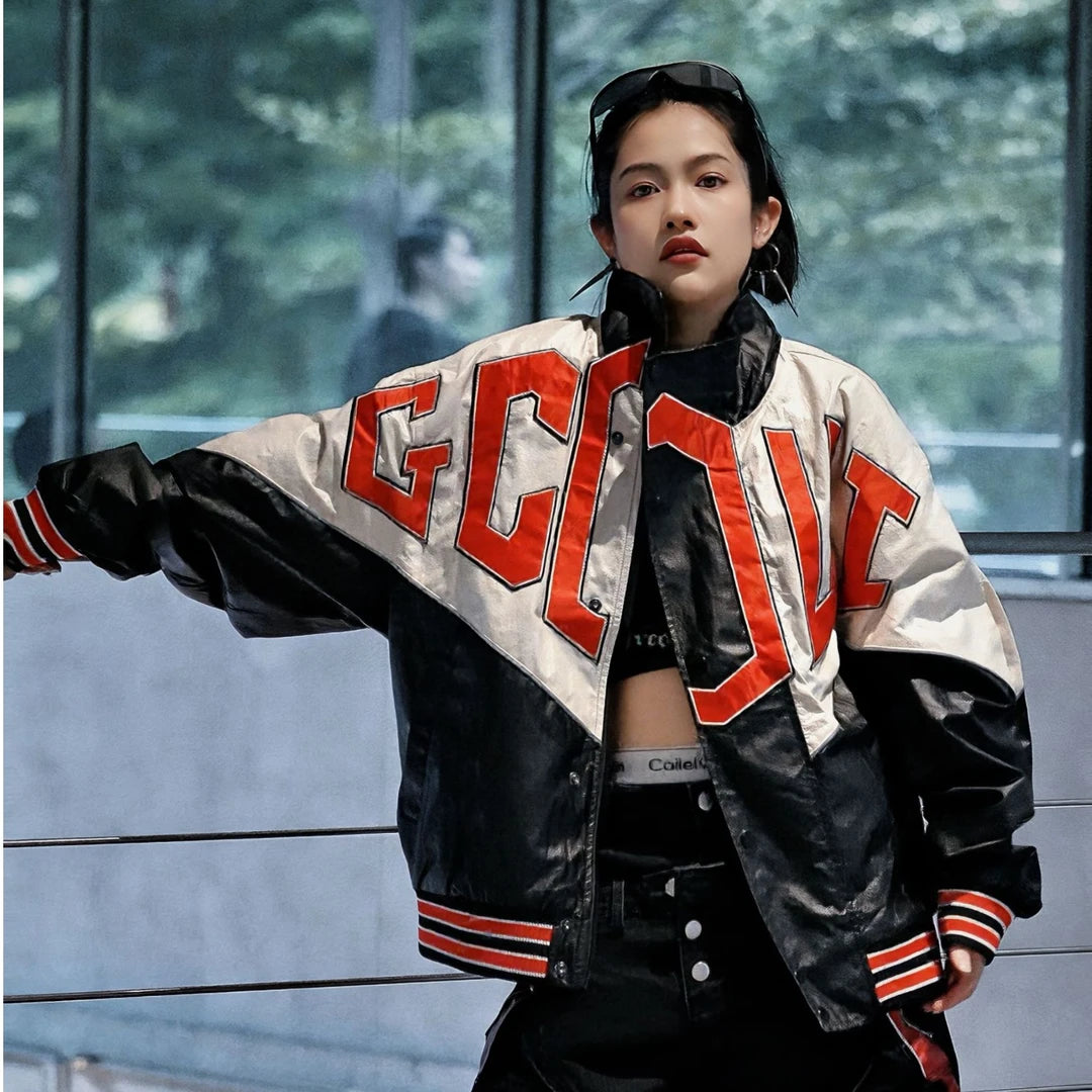 Sanhoostudio jacket featuring embroidered detailing, contrast colorblock panels, and a structured stand collar with a relaxed fit. Designed for fall and winter streetwear styling, combining motorcycle-inspired attitude with versatile everyday comfort and bold urban appeal.