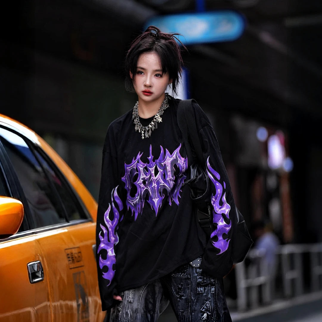 Sanhoostudio short sleeve T-shirt featuring purple-toned hand-painted artwork, contrast patchwork detailing, and a relaxed oversized silhouette. Designed for bold summer streetwear styling with expressive visual texture, comfortable everyday wear, and a distinctive high-street aesthetic.