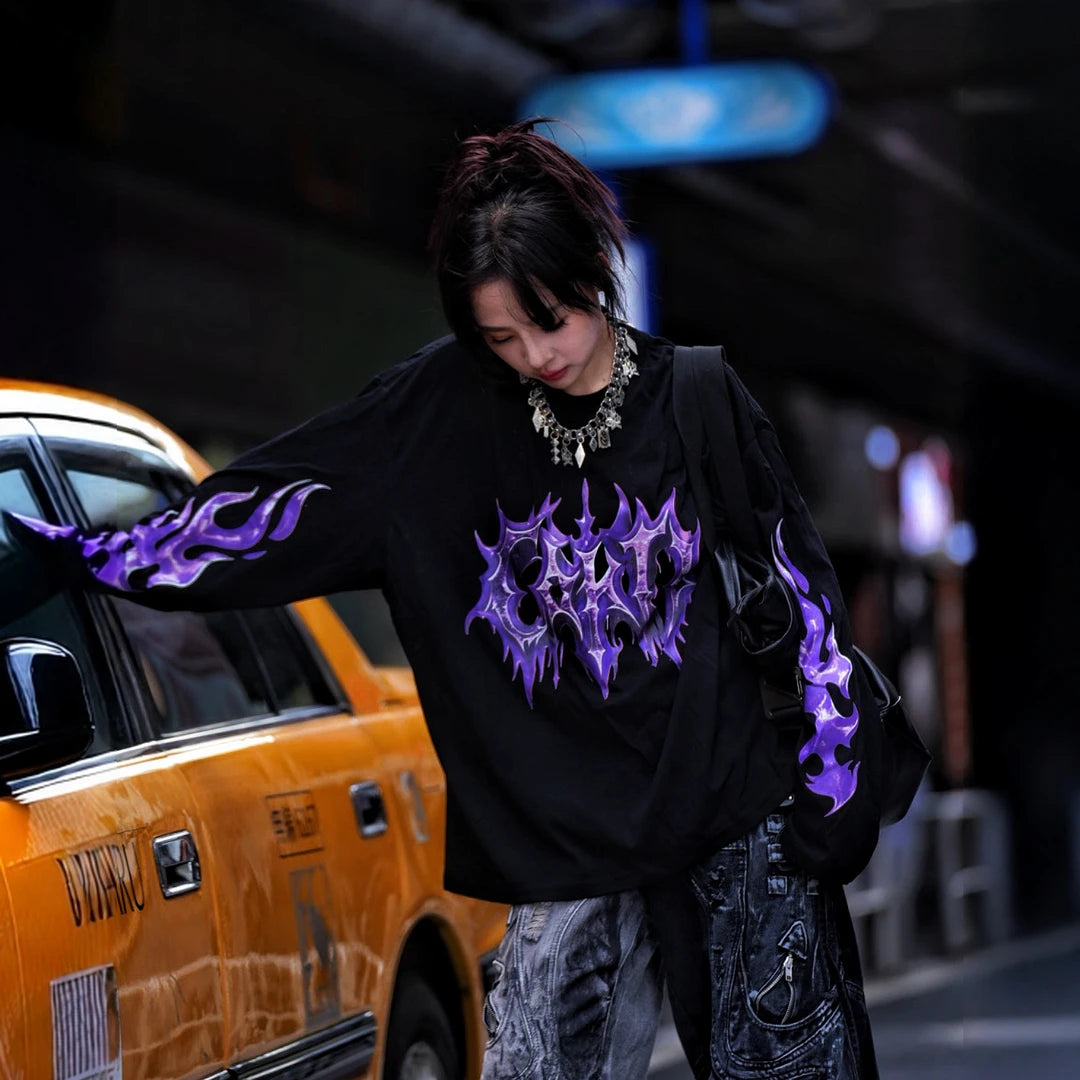Sanhoostudio short sleeve T-shirt featuring purple-toned hand-painted artwork, contrast patchwork detailing, and a relaxed oversized silhouette. Designed for bold summer streetwear styling with expressive visual texture, comfortable everyday wear, and a distinctive high-street aesthetic.