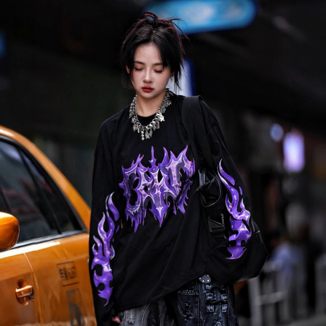 Sanhoostudio short sleeve T-shirt featuring purple-toned hand-painted artwork, contrast patchwork detailing, and a relaxed oversized silhouette. Designed for bold summer streetwear styling with expressive visual texture, comfortable everyday wear, and a distinctive high-street aesthetic.
