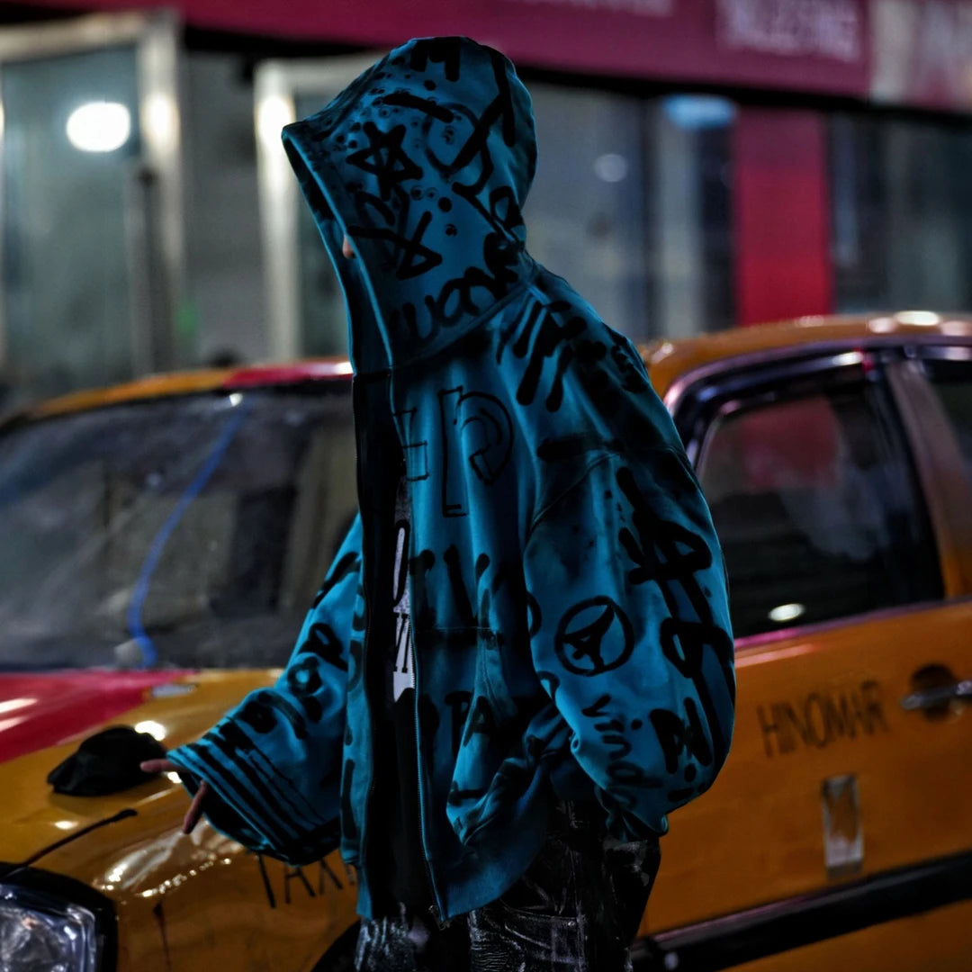 Sanhoostudio long sleeve cardigan featuring statement graphic artwork, an open-front design, and a relaxed wide oversized silhouette. Built for contemporary streetwear layering with comfortable movement, bold visual character, and effortless high-street styling.