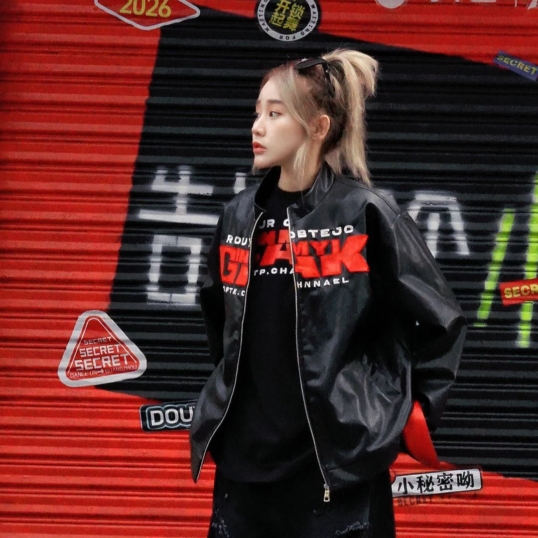 Sanhoostudio PU leather jacket featuring embroidered letter detailing, a structured shoulder silhouette, and vintage motorcycle-inspired styling. Designed for bold streetwear layering with a sleek leather look, versatile fit, and distinctive urban character.