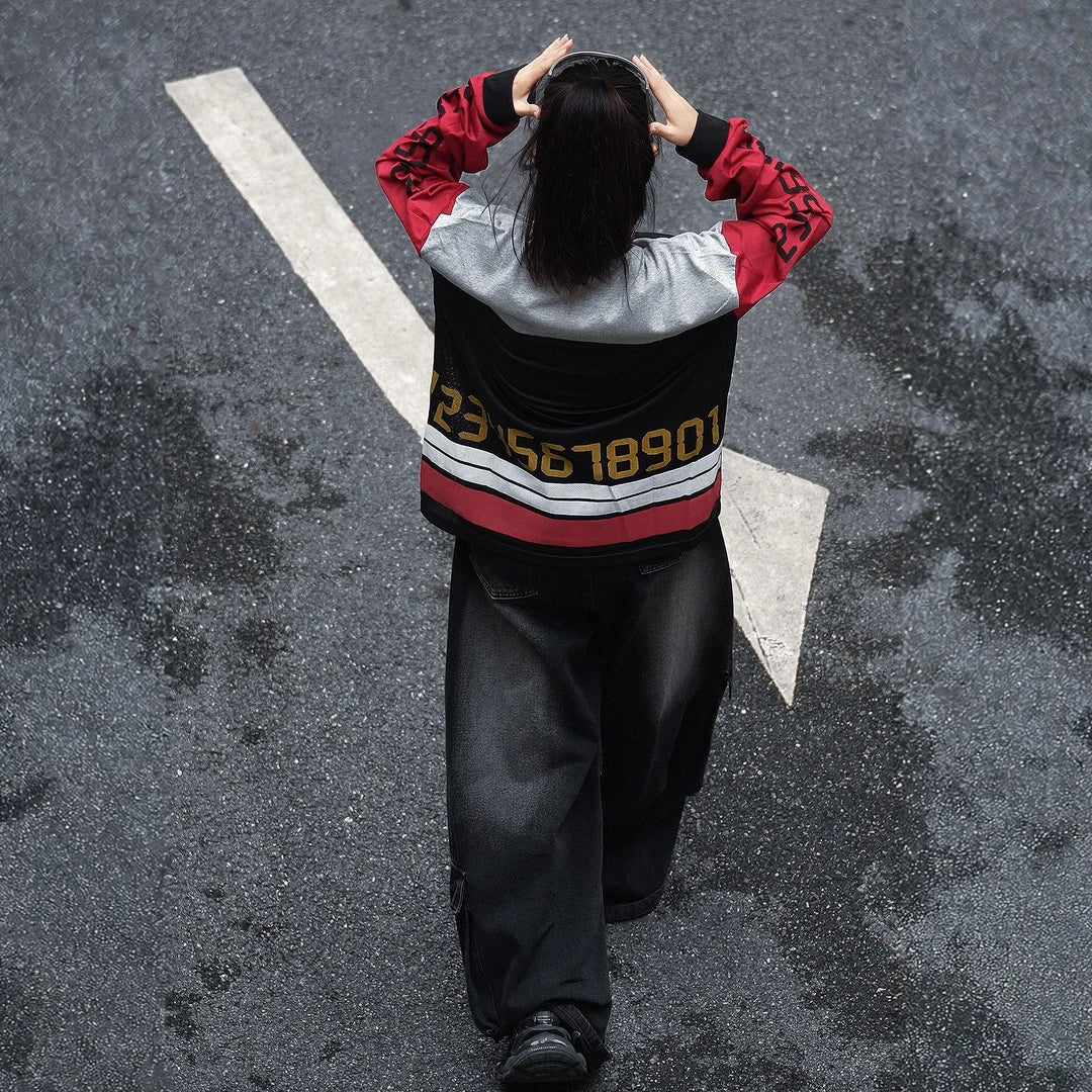 Sanhoostudio T-shirt featuring red, black, and grey colorblock patchwork with number and letter graphic prints. Designed with a relaxed streetwear silhouette for bold everyday styling, comfortable wear, and a distinctive high-street aesthetic.