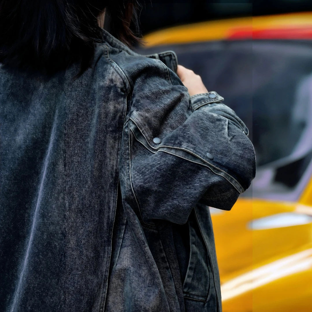 Sanhoostudio denim jacket featuring vintage washed treatment, patchwork construction, a structured stand collar, and a relaxed oversized silhouette. Designed for statement streetwear layering with rugged denim texture, comfortable wear, and versatile urban styling.