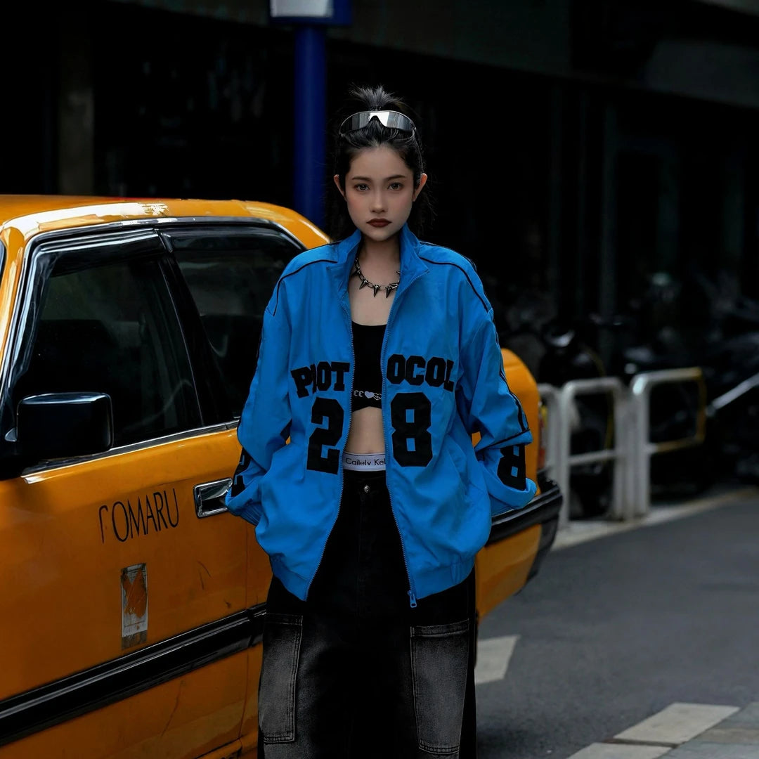 Sanhoostudio jacket featuring vintage-inspired contrast stripes, colorblock construction, a stand collar, and a zip-up front with a relaxed oversized fit. Designed for high-street layering with retro character, everyday comfort, and bold urban styling.
