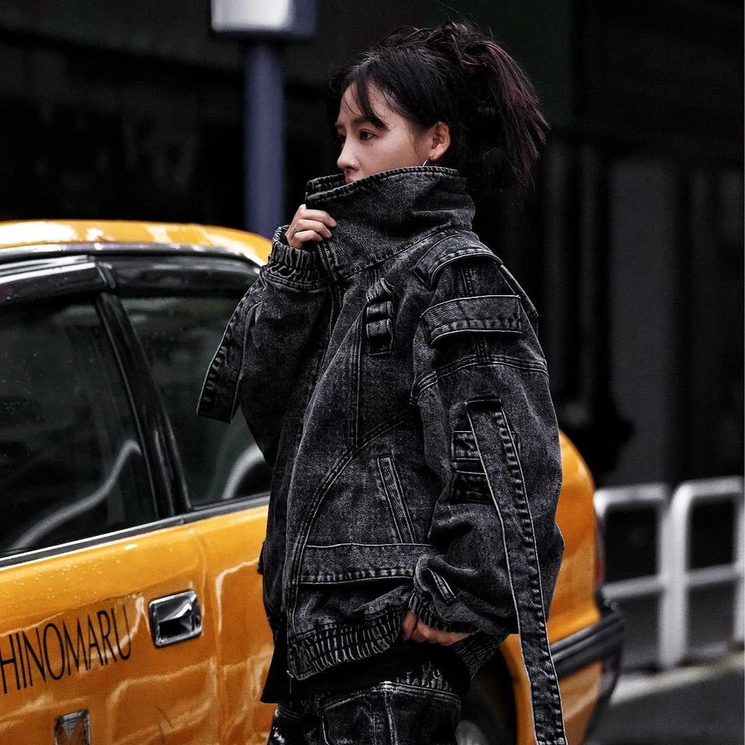 Sanhoostudio denim jacket featuring rock grey tones, hand-painted graffiti details, distressed staining, mud-dye treatment, and a relaxed oversized silhouette. Designed for statement streetwear layering with rugged visual texture, vintage-inspired character, and bold everyday urban styling.