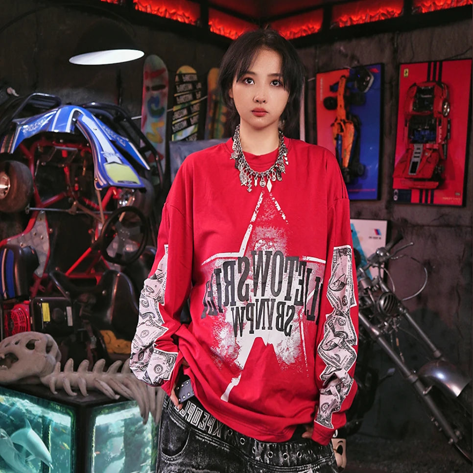 Sanhoostudio long sleeve T-shirt featuring dollar-inspired digital graphics, lightweight construction, and a relaxed oversized fit. Designed for effortless layering and hip-hop streetwear styling with comfortable everyday wear, bold visual character, and versatile seasonal appeal.