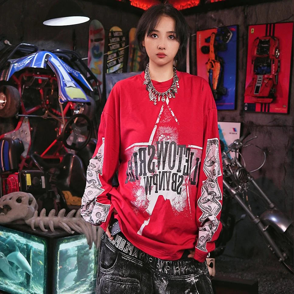 Sanhoostudio long sleeve T-shirt featuring dollar-inspired digital graphics, lightweight construction, and a relaxed oversized fit. Designed for effortless layering and hip-hop streetwear styling with comfortable everyday wear, bold visual character, and versatile seasonal appeal.