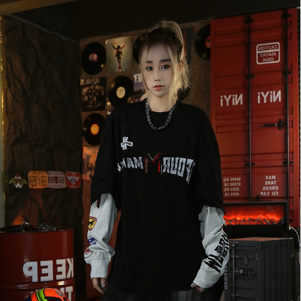 Sanhoostudio long sleeve T-shirt featuring rhinestone embellishments, contrast colorblock detailing, and a layered two-piece effect with a relaxed oversized fit. Designed for fall streetwear styling with standout texture, comfortable wear, and versatile unisex appeal.
