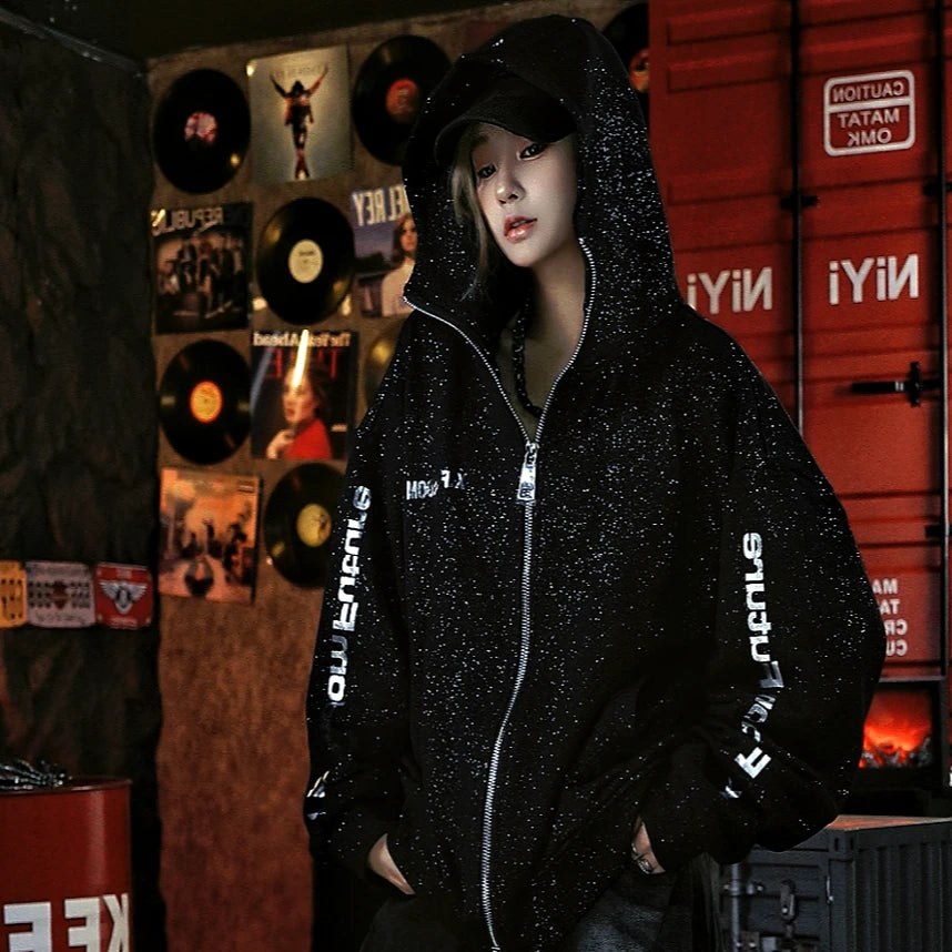 Sanhoostudio zip hoodie featuring liquid-metal inspired detailing, all-over star embellishments, and a statement textured finish. Designed for bold fall streetwear layering with comfortable everyday wear, distinctive visual depth, and a futuristic urban aesthetic.