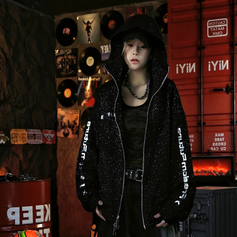 Sanhoostudio zip hoodie featuring liquid-metal inspired detailing, all-over star embellishments, and a statement textured finish. Designed for bold fall streetwear layering with comfortable everyday wear, distinctive visual depth, and a futuristic urban aesthetic.