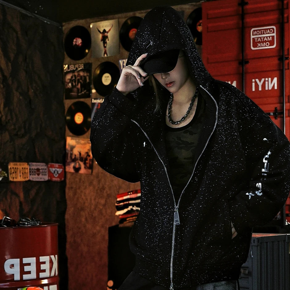 Sanhoostudio zip hoodie featuring liquid-metal inspired detailing, all-over star embellishments, and a statement textured finish. Designed for bold fall streetwear layering with comfortable everyday wear, distinctive visual depth, and a futuristic urban aesthetic.