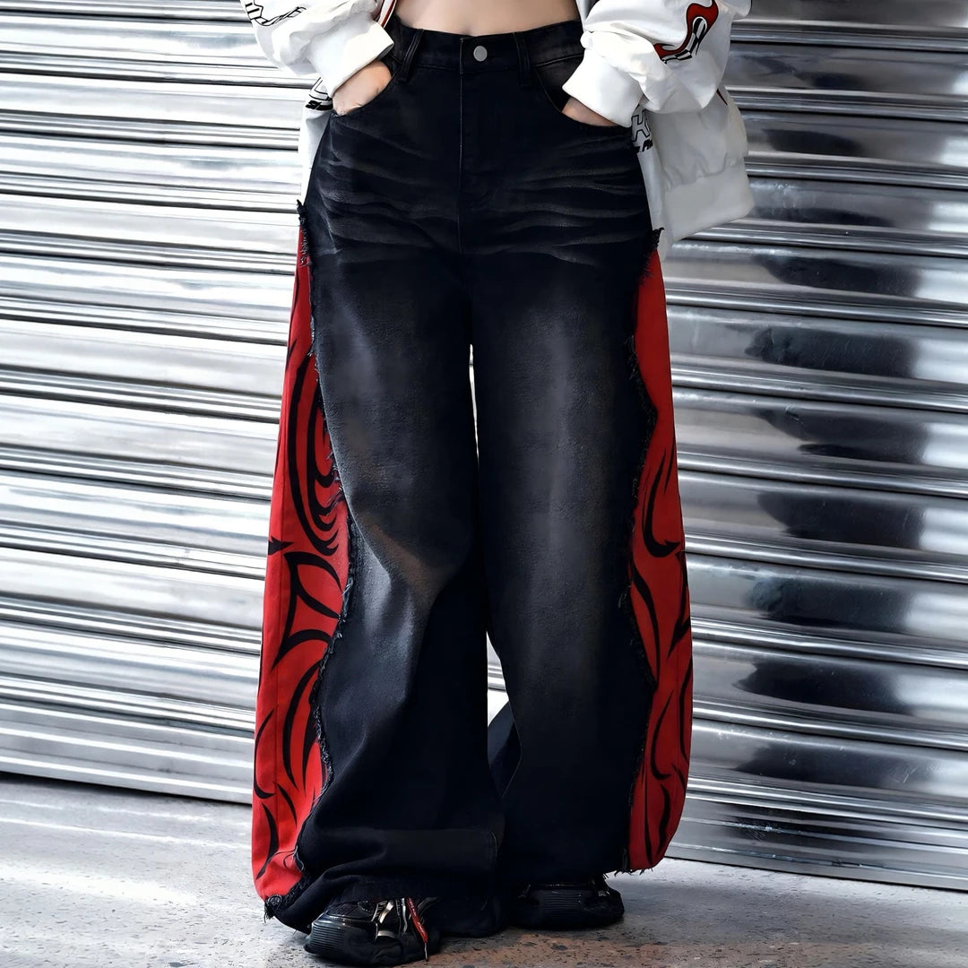 Sanhoostudio denim pants featuring flame-inspired patchwork, raw frayed detailing, and a relaxed wide leg silhouette with an extended floor-length cut. Designed for statement streetwear styling with bold contrast, vintage character, and effortless oversized proportions.