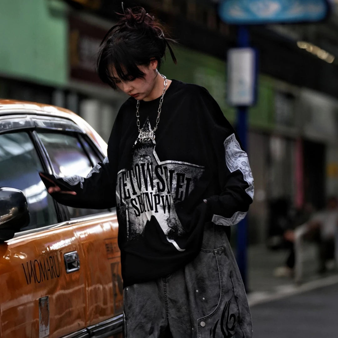 Sanhoostudio long sleeve T-shirt featuring dollar-inspired digital graphics, lightweight fabric construction, and a relaxed oversized silhouette. Designed for effortless layering and streetwear styling with breathable comfort, bold visual character, and versatile everyday wear.