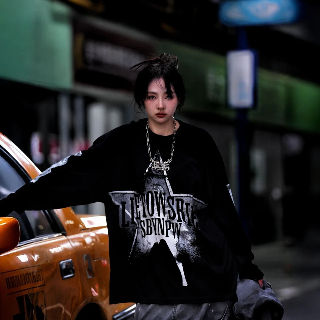 Sanhoostudio long sleeve T-shirt featuring dollar-inspired digital graphics, lightweight fabric construction, and a relaxed oversized silhouette. Designed for effortless layering and streetwear styling with breathable comfort, bold visual character, and versatile everyday wear.