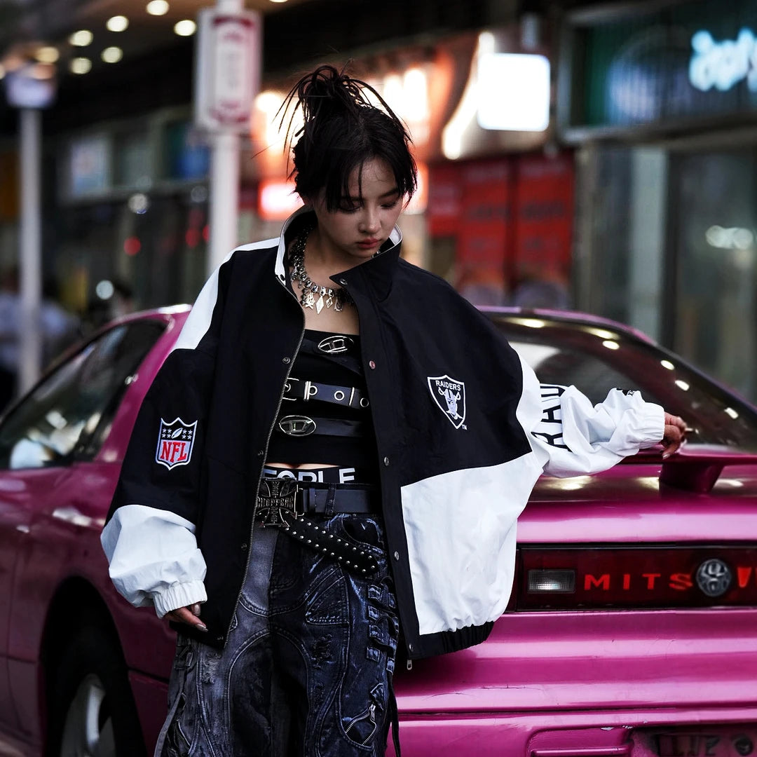Sanhoostudio long sleeve cardigan featuring statement shield-inspired graphic artwork, an open-front construction, and a relaxed oversized silhouette. Designed for bold streetwear layering with comfortable movement, distinctive visual character, and effortless high-street styling.