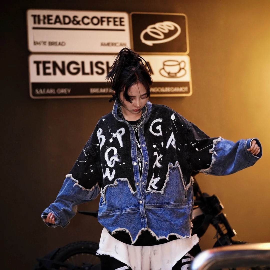 Sanhoostudio denim jacket featuring hand-painted graphics, distressed stain effects, brushed color detailing, mud-dye treatment, and a relaxed oversized silhouette. Designed for statement streetwear layering with rugged visual texture, vintage character, and distinctive everyday urban styling.