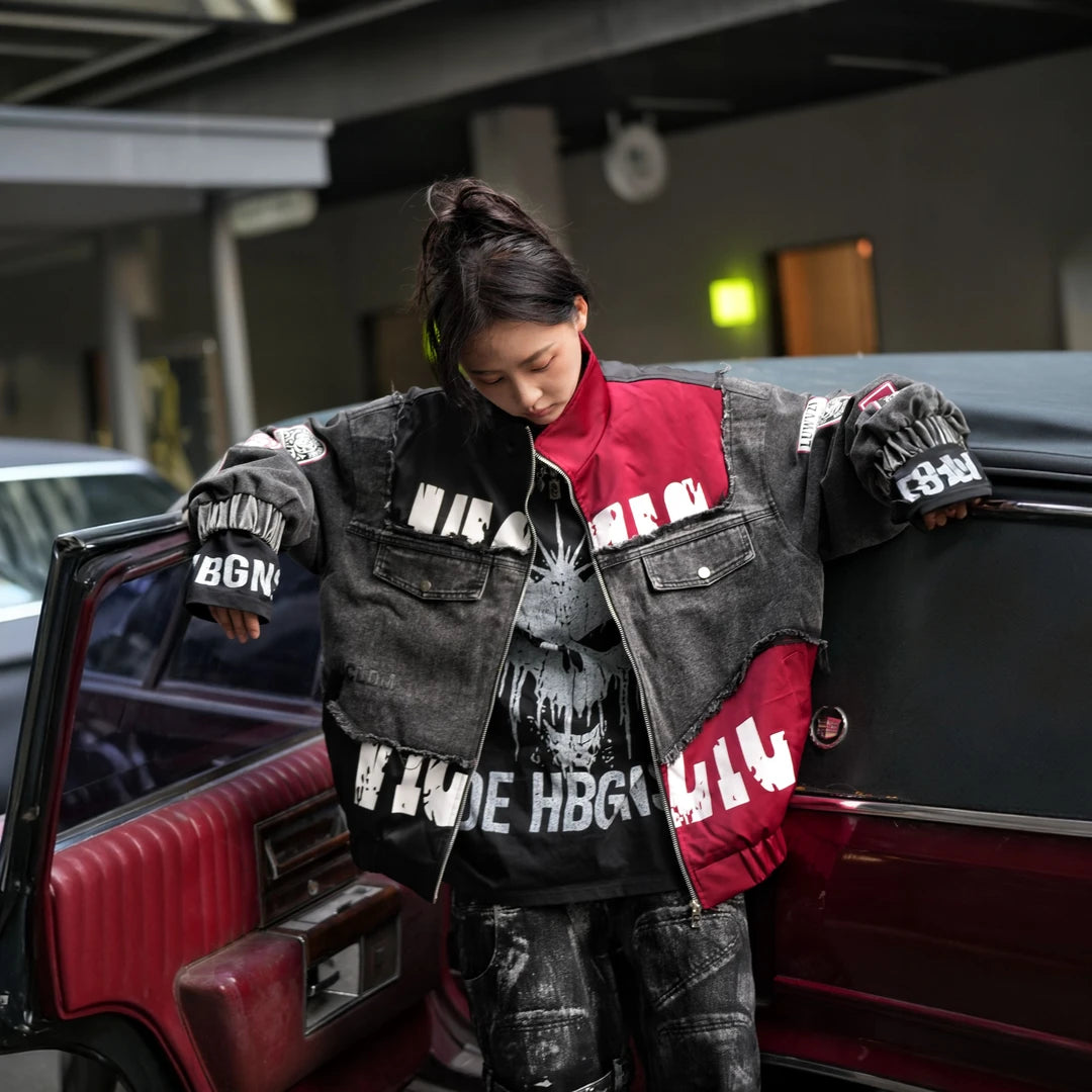 Sanhoostudio denim jacket featuring black patch applique embroidery, distressed surface detailing, and a relaxed oversized silhouette with added seasonal warmth. Designed for statement streetwear layering with rugged texture, handcrafted character, and versatile urban styling.
