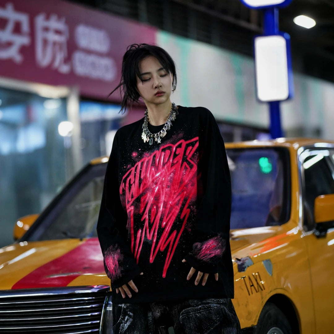 Sanhoostudio long sleeve T-shirt featuring red galaxy-inspired digital graphics, lightweight fabric construction, and a relaxed oversized silhouette. Designed for effortless layering with bold visual impact, breathable everyday comfort, and versatile streetwear styling.