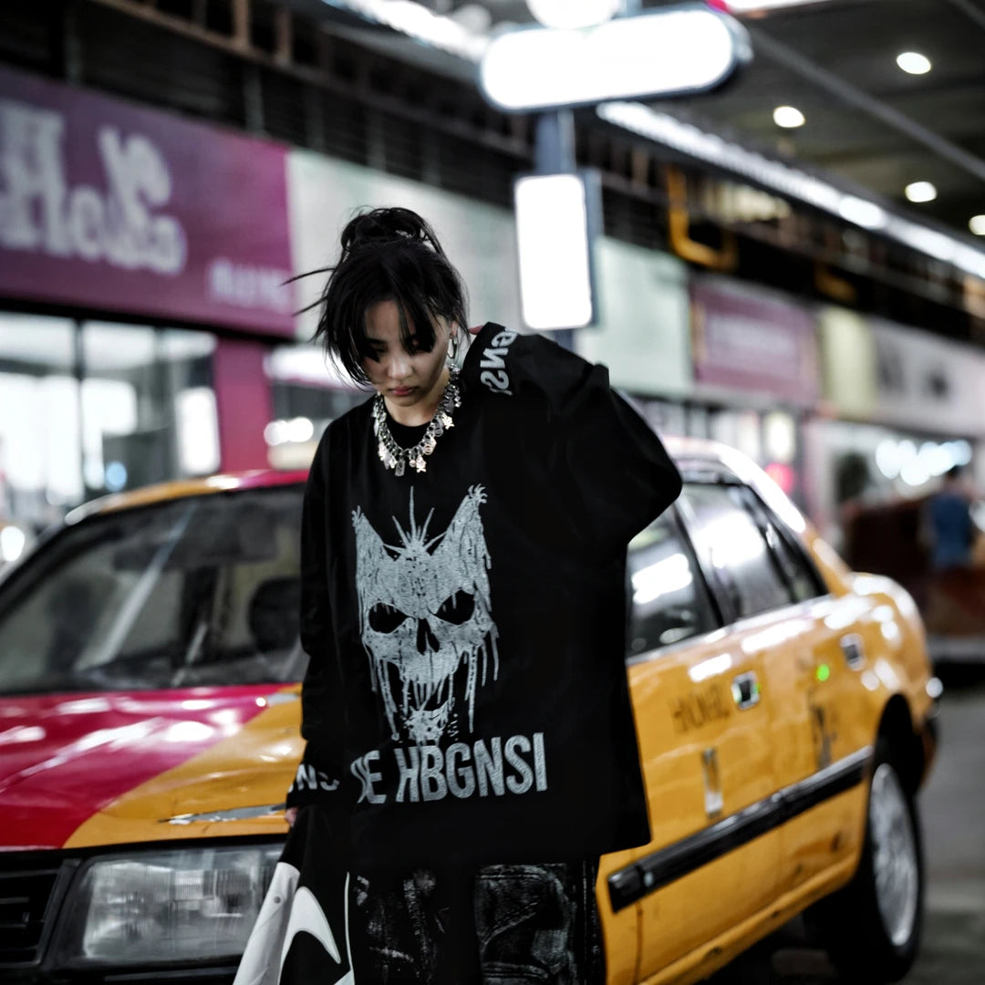 Sanhoostudio long sleeve T-shirt featuring statement digital print graphics, lightweight construction, and a relaxed oversized silhouette. Designed for dark streetwear styling and effortless layering with breathable comfort, bold visual character, and versatile everyday wear.
