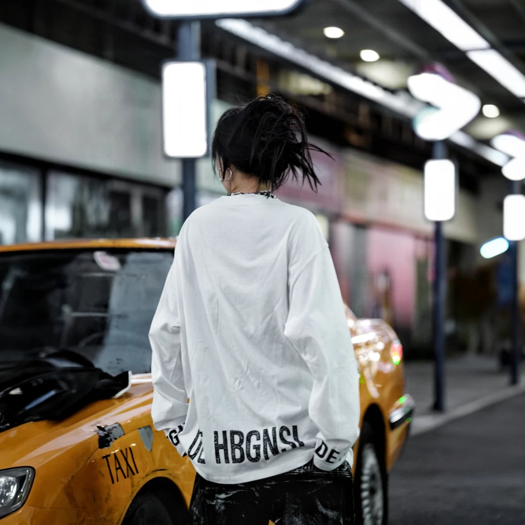 Sanhoostudio long sleeve T-shirt featuring statement digital print graphics, lightweight construction, and a relaxed oversized silhouette. Designed for dark streetwear styling and effortless layering with breathable comfort, bold visual character, and versatile everyday wear.