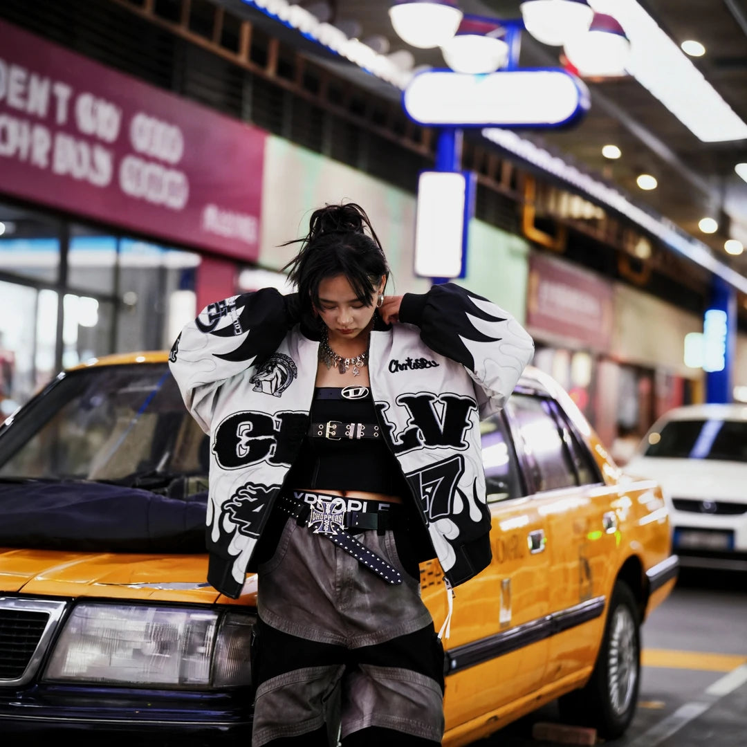 Sanhoostudio padded jacket featuring warhorse-inspired embroidery, contrast patchwork detailing, and a relaxed oversized silhouette. Designed for colder-season streetwear layering with vintage character, comfortable warmth, bold embroidered artwork, and distinctive everyday urban styling.