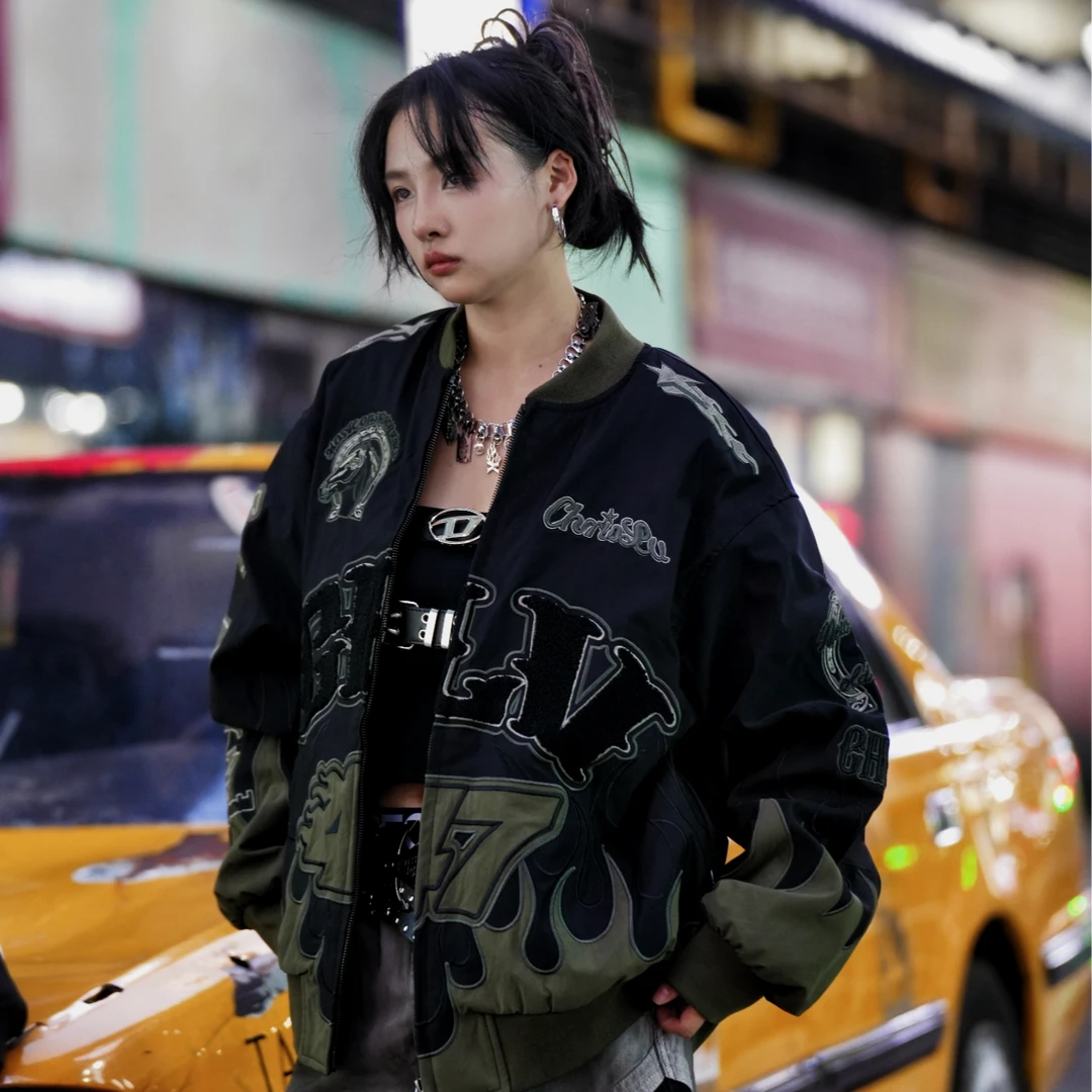 Sanhoostudio padded jacket featuring warhorse-inspired embroidery, contrast patchwork detailing, and a relaxed oversized silhouette. Designed for colder-season streetwear layering with vintage character, comfortable warmth, bold embroidered artwork, and distinctive everyday urban styling.