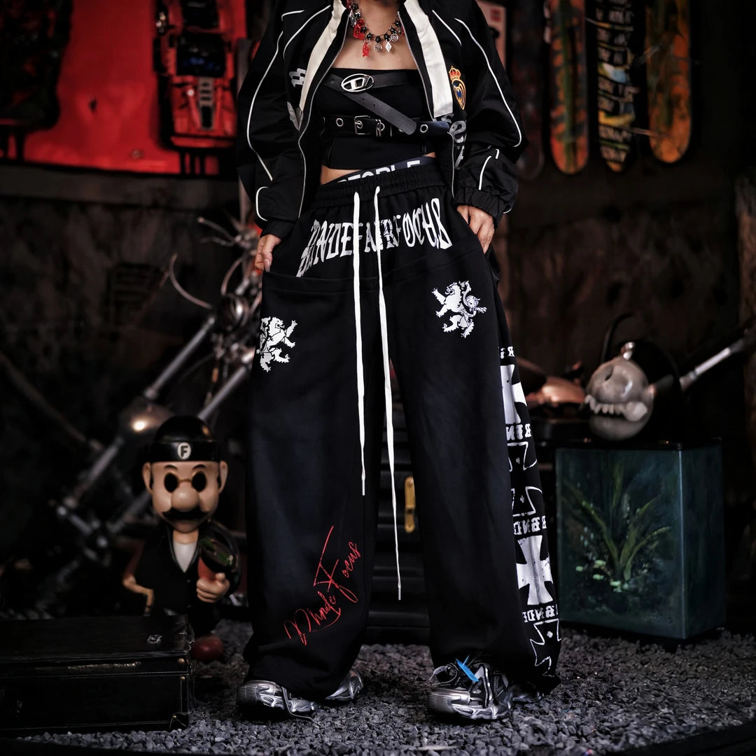 Sanhoostudio sweatpants featuring heavyweight washed fabric, distressed detailing, patchwork construction, and a relaxed wide leg silhouette. Designed for contemporary streetwear styling with comfortable movement, rugged vintage texture, oversized proportions, and versatile everyday wear.