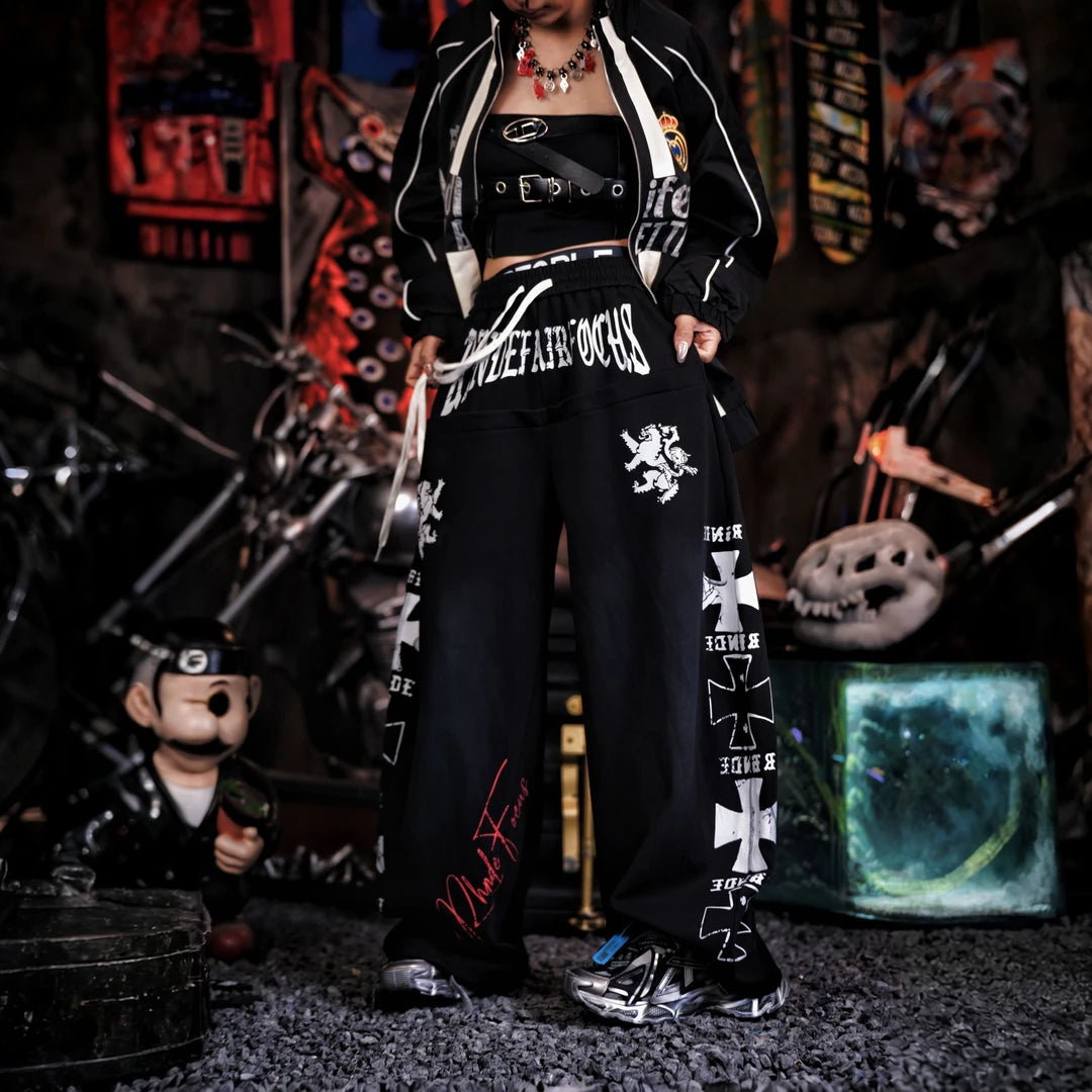 Sanhoostudio sweatpants featuring heavyweight washed fabric, distressed detailing, patchwork construction, and a relaxed wide leg silhouette. Designed for contemporary streetwear styling with comfortable movement, rugged vintage texture, oversized proportions, and versatile everyday wear.