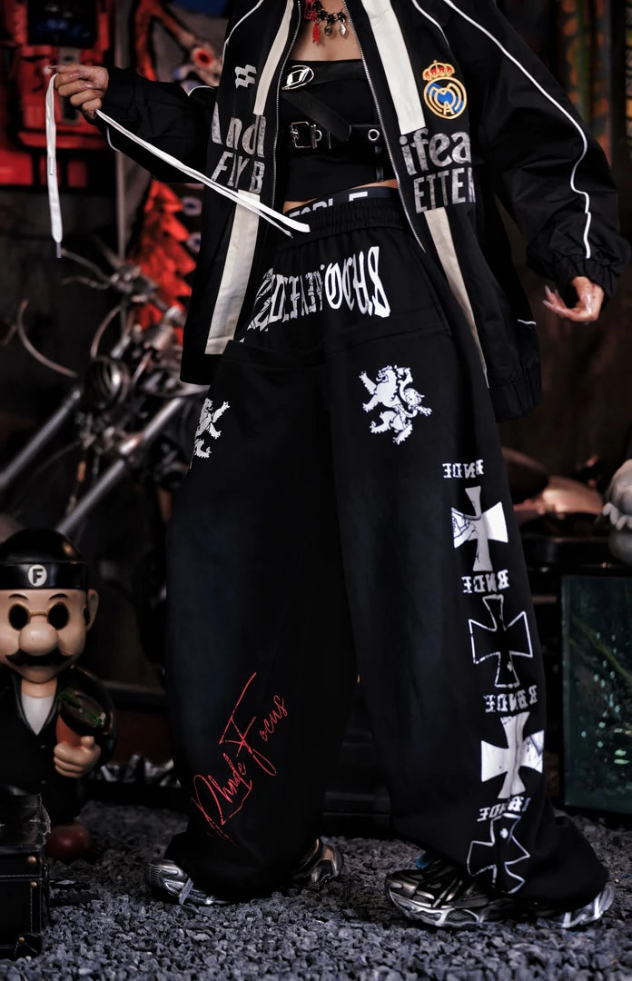 Sanhoostudio sweatpants featuring heavyweight washed fabric, distressed detailing, patchwork construction, and a relaxed wide leg silhouette. Designed for contemporary streetwear styling with comfortable movement, rugged vintage texture, oversized proportions, and versatile everyday wear.