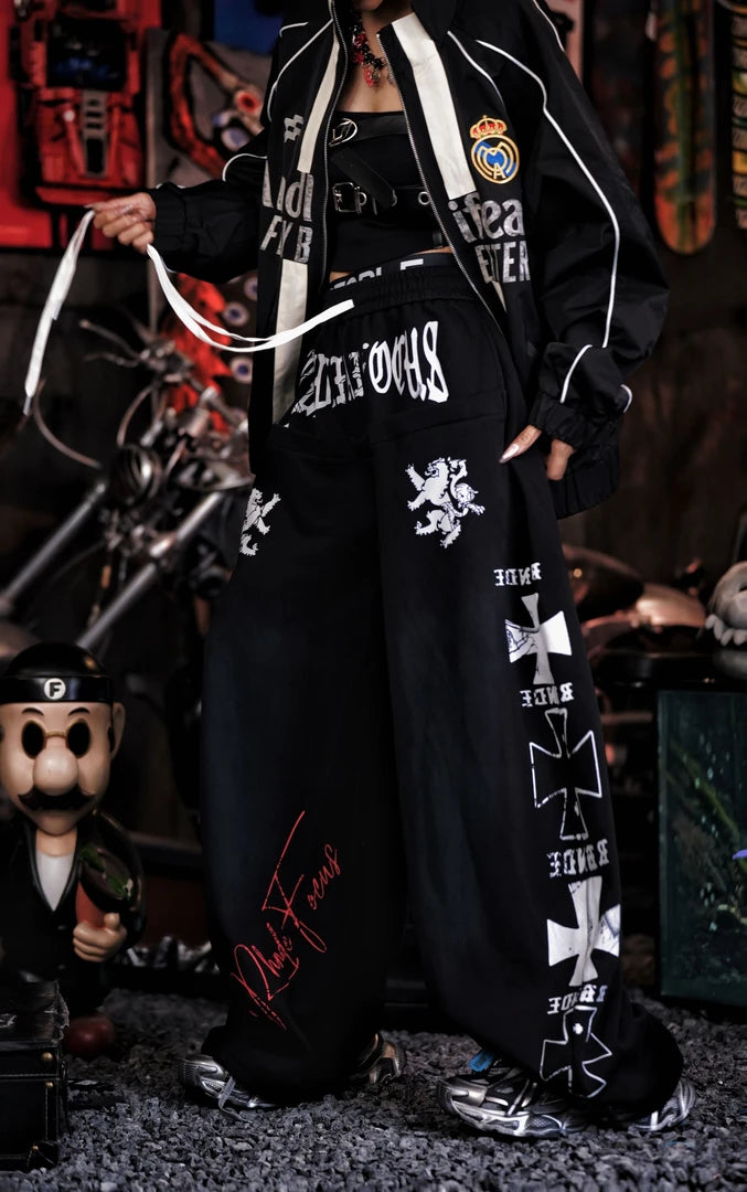 Sanhoostudio sweatpants featuring heavyweight washed fabric, distressed detailing, patchwork construction, and a relaxed wide leg silhouette. Designed for contemporary streetwear styling with comfortable movement, rugged vintage texture, oversized proportions, and versatile everyday wear.