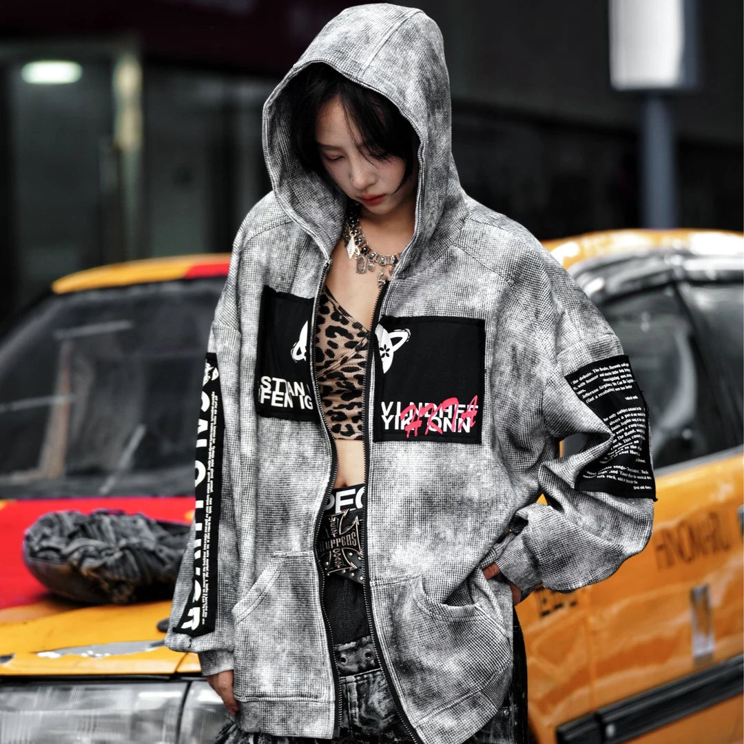 Sanhoostudio zip hoodie featuring a meteor grey colorway, statement graphic artwork, and a relaxed wide oversized silhouette. Designed for contemporary streetwear layering with comfortable everyday wear, bold visual character, and versatile urban styling.