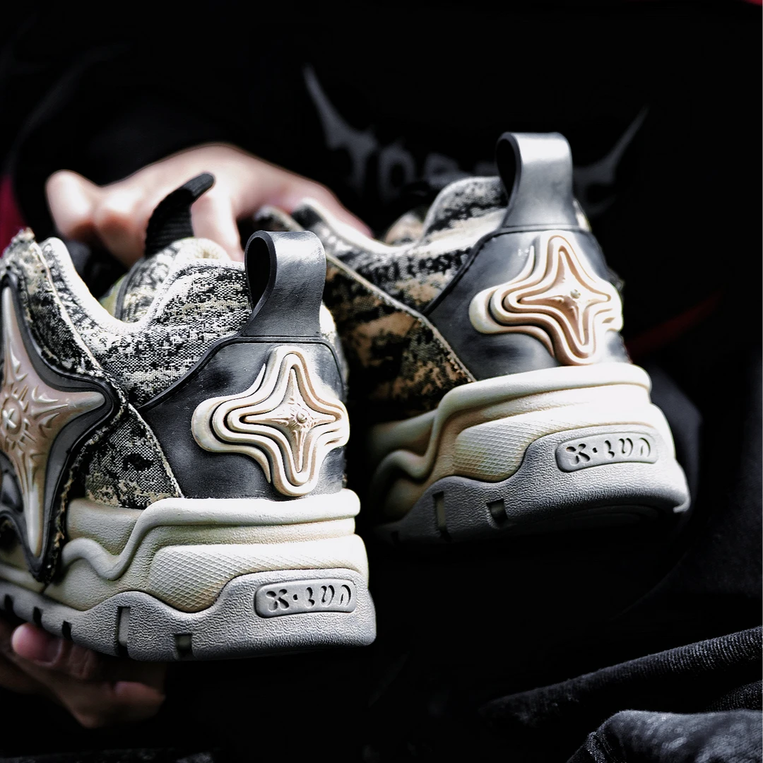 Sanhoostudio dad sneakers featuring oracle-inspired graphic detailing, a chunky 8 cm platform sole, and a bold layered silhouette. Designed for contemporary streetwear styling with enhanced height, comfortable everyday wear, and distinctive visual character.